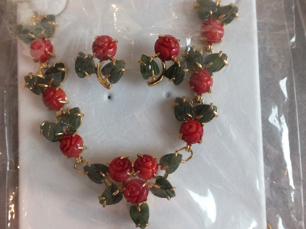 Dyed coral roses with small jade leaves with gold plated chain and earrings